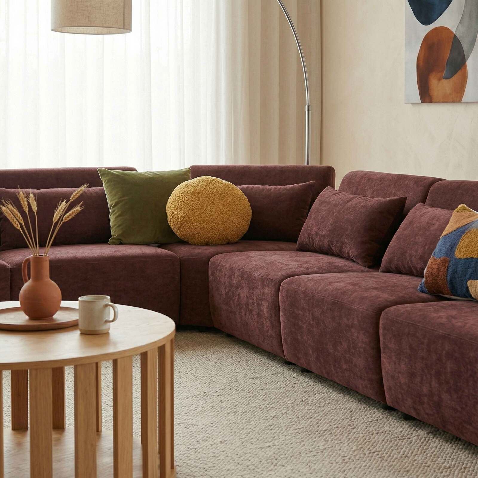 Divano angolare modulare 7 posti in tessuto con cuscini